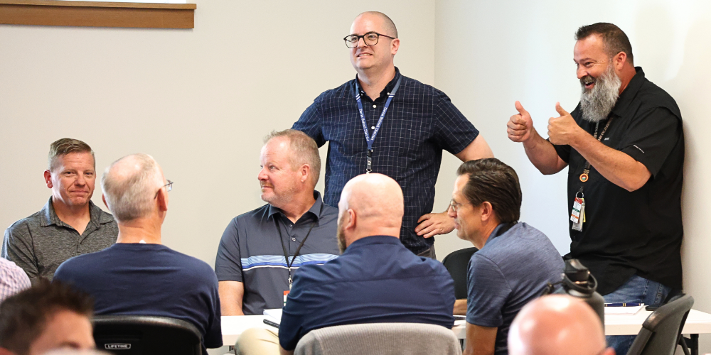 A group of Technology Services employees working together.