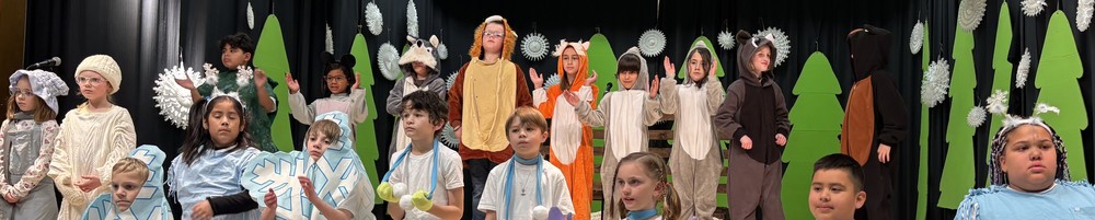2nd grade students dressed up as animals for their play The Mitten