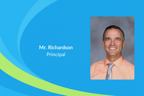 Mr. Richardson Principal photo in orange shirt and silver tie