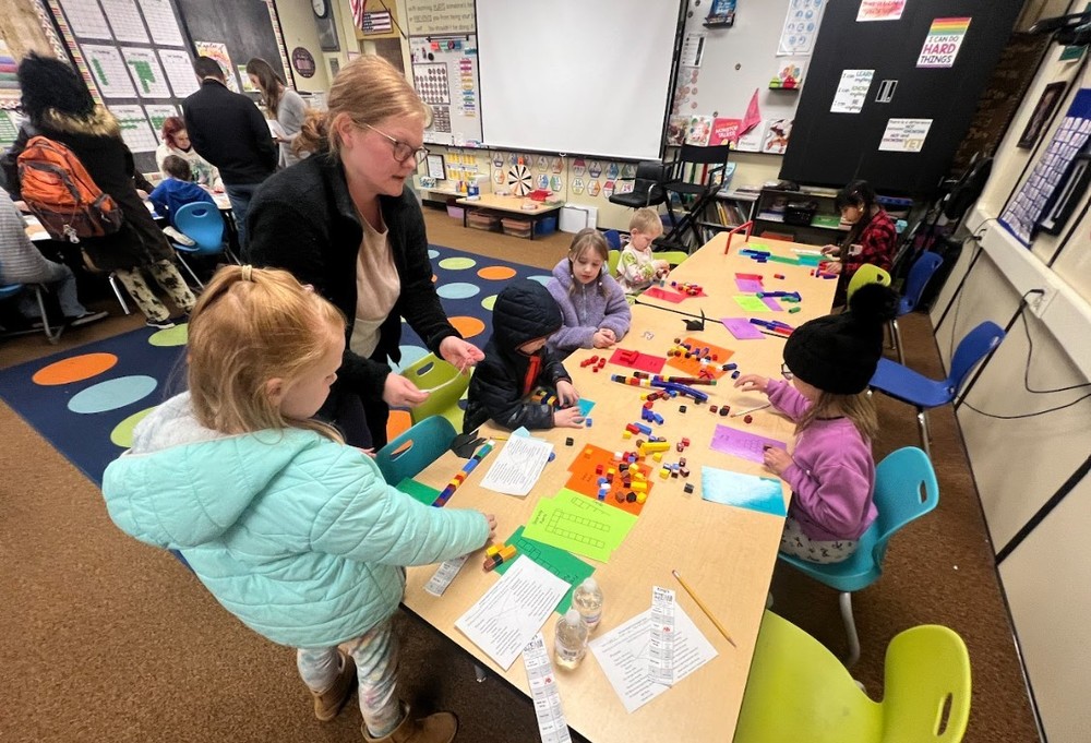 students and families during a STEAM (science, technology, engineering, art, math) night.