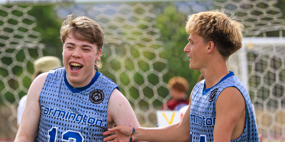 Students celebrating after making a goal.