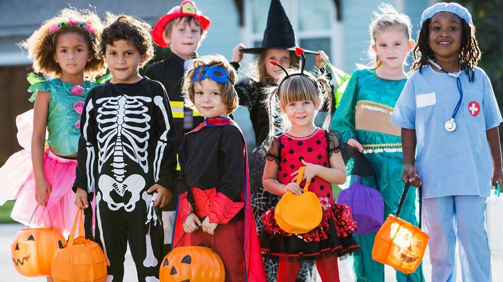 kids dressed up in halloween costumes
