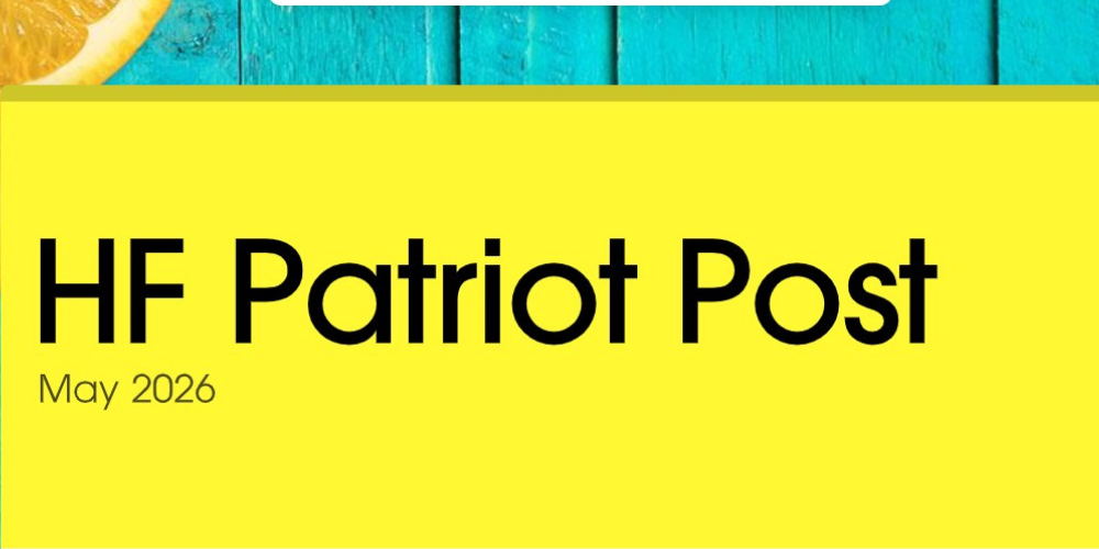 Yellow banner with the words HF Patriot Post May 2026.Behind the banner is wood painted turquoise with oranges laying on it.