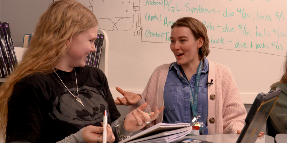 A substitute talking with a student
