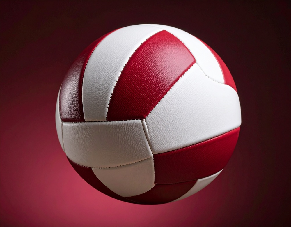 Red and white volleyball with muted burgundy background