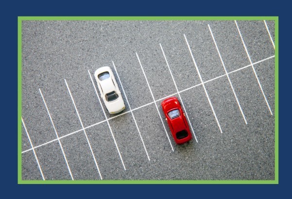 2 Vehicles in a parking lot.