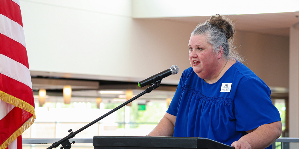 Utah PTA President speaking at an award ceremony.