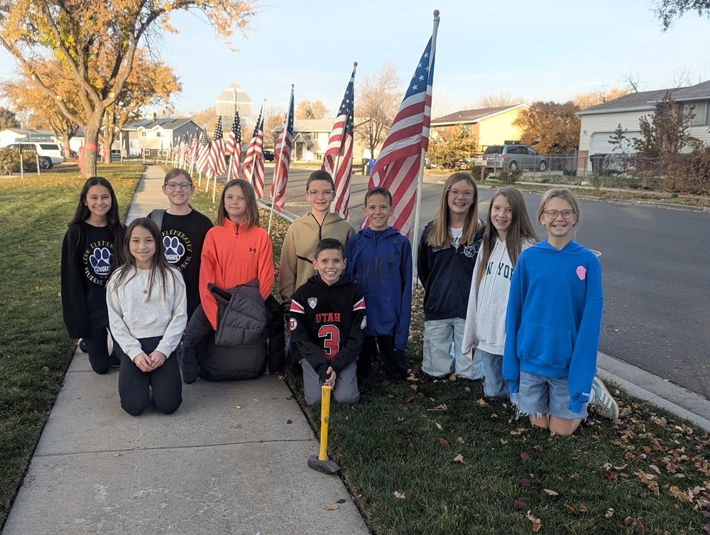 Student Council with flags for Veteran's Day
