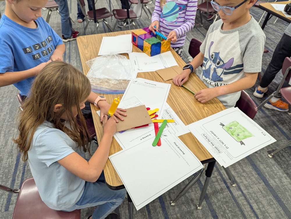 2nd grade students working on a stem project