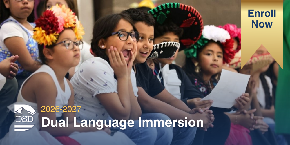 Students show smiles and excitement during Spanish cultural celebration with the text of Dual Language Immersion Enroll Now for 2026-2027