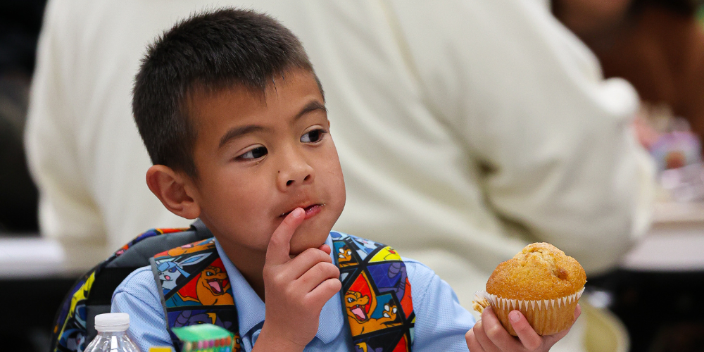 Student eating muffin