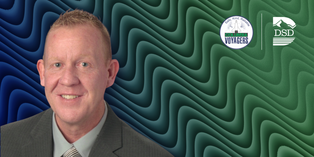 Assistant principal with a blue and green wavy background and the Columbia Elementary and DSD logos.