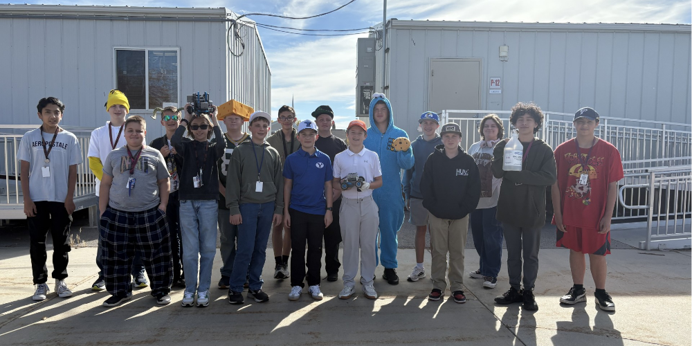 Robotics class displaying some of their Halloween robots they created in class.