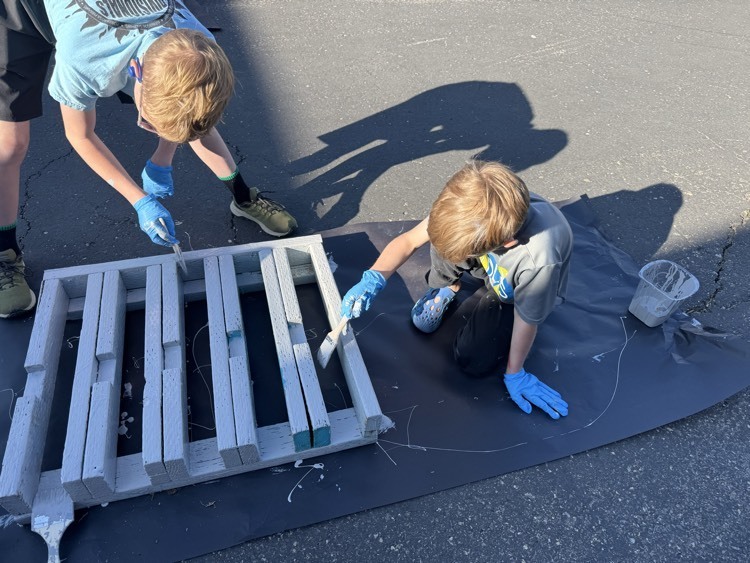 two boys painting, the scooter racks