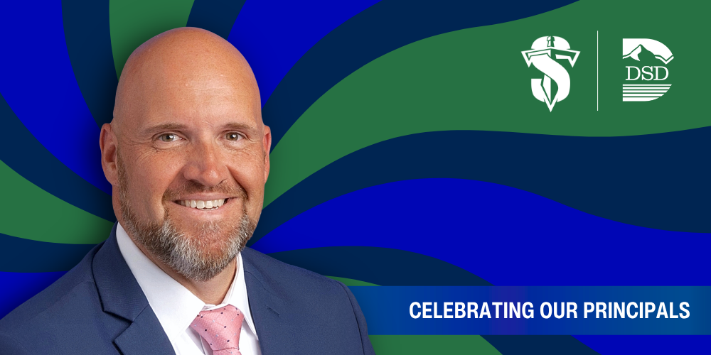 A principal in front of a wavy background with a banner that reads "Celebrating Our Principals"