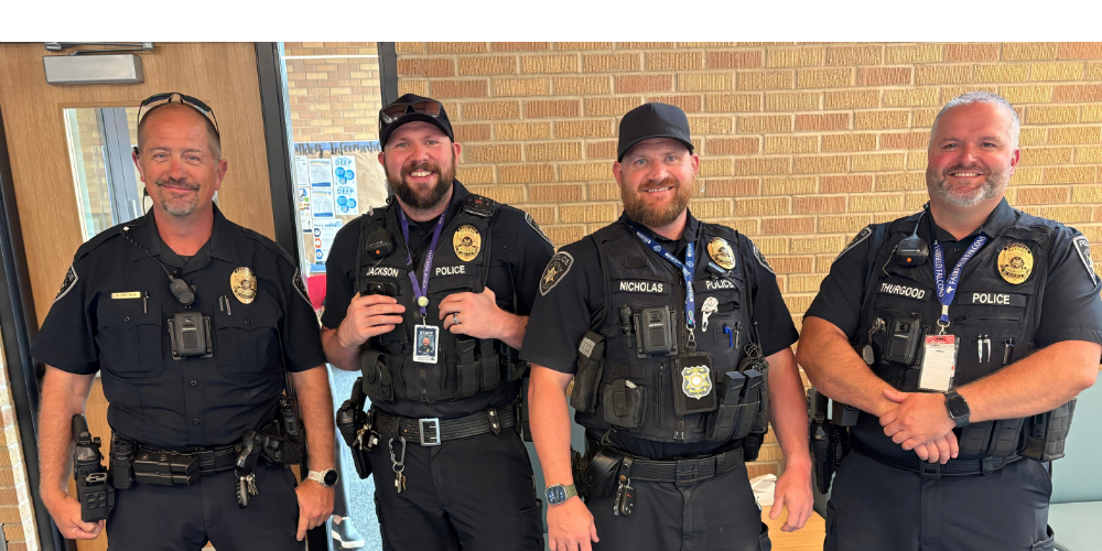 4 officers pose for a photo