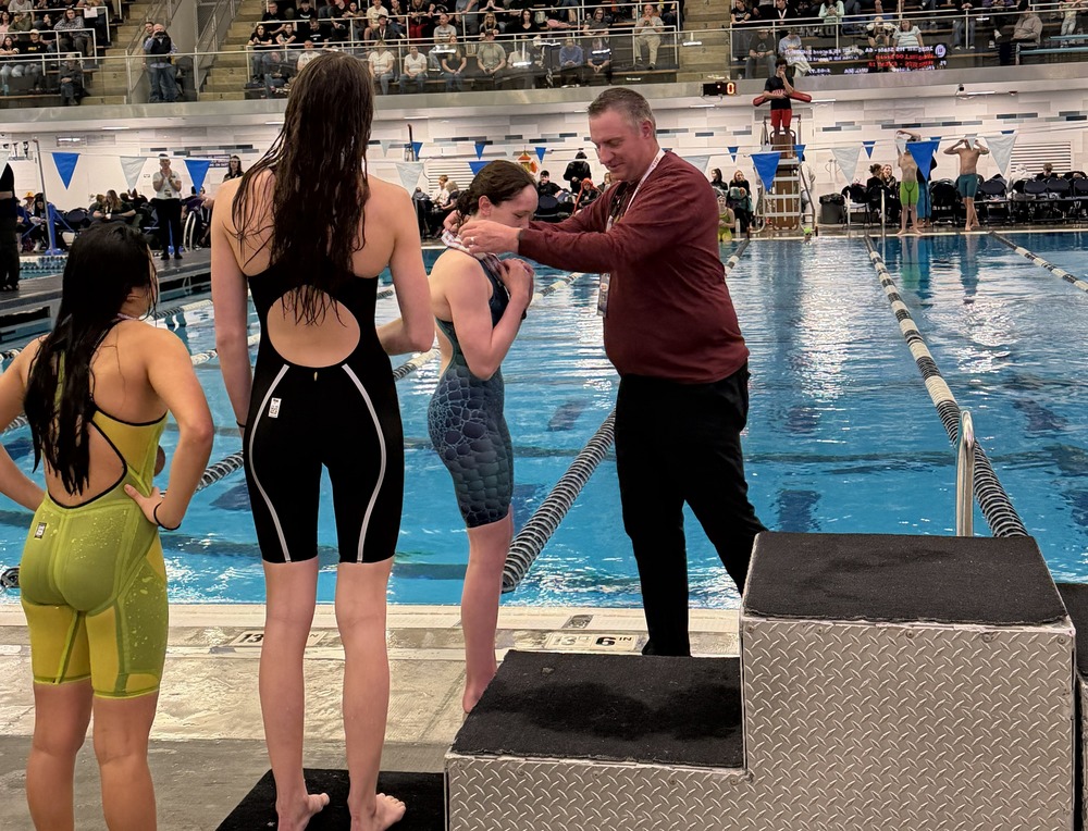 Layleigh Turner receiving medal for winning state 200 IM sweimming