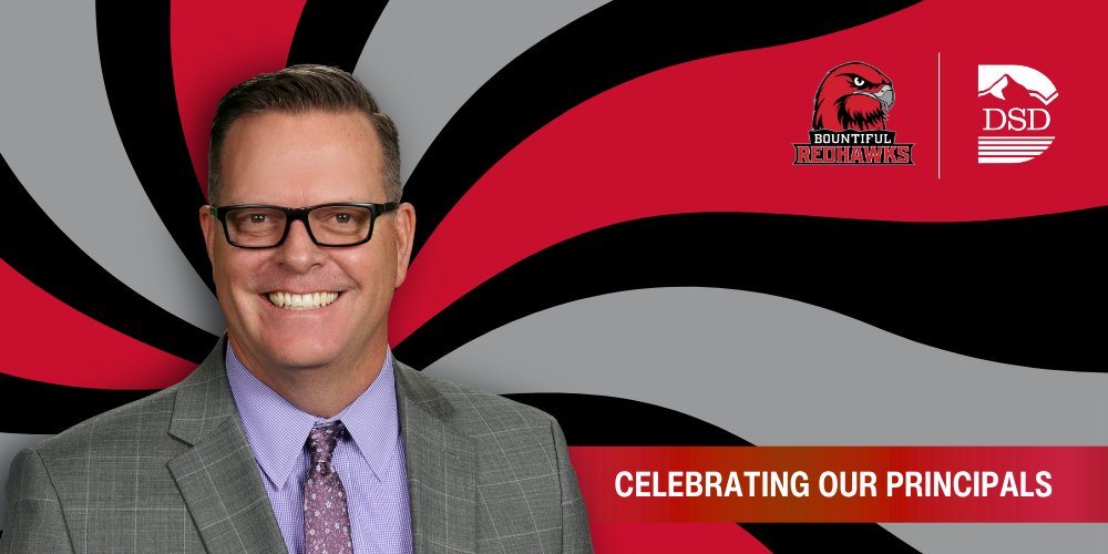 A principal in front of a wavy background with a banner that reads "Celebrating Our Principals"
