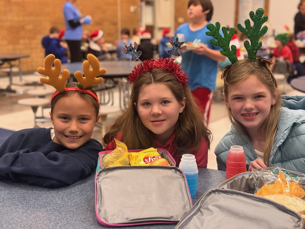 Students with holiday antler headbands