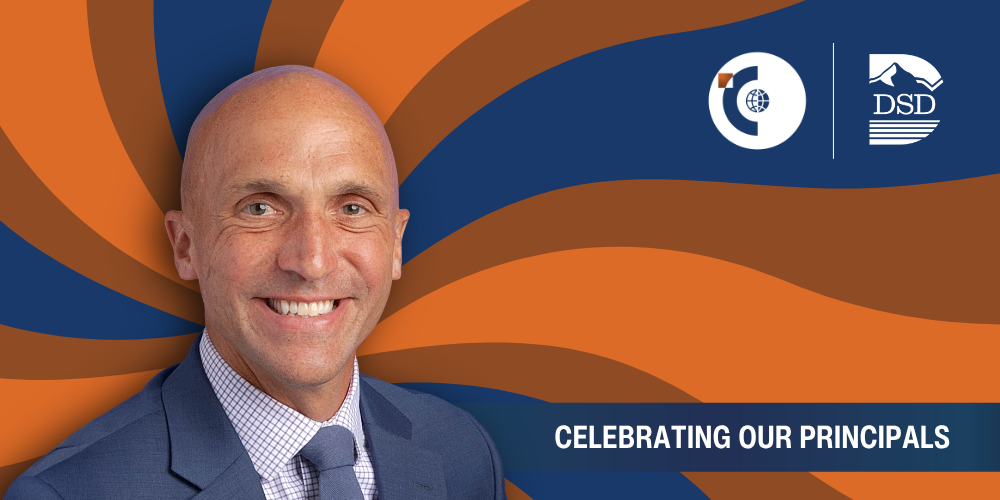 A principal in front of a wavy background with a banner that reads "Celebrating Our Principals"
