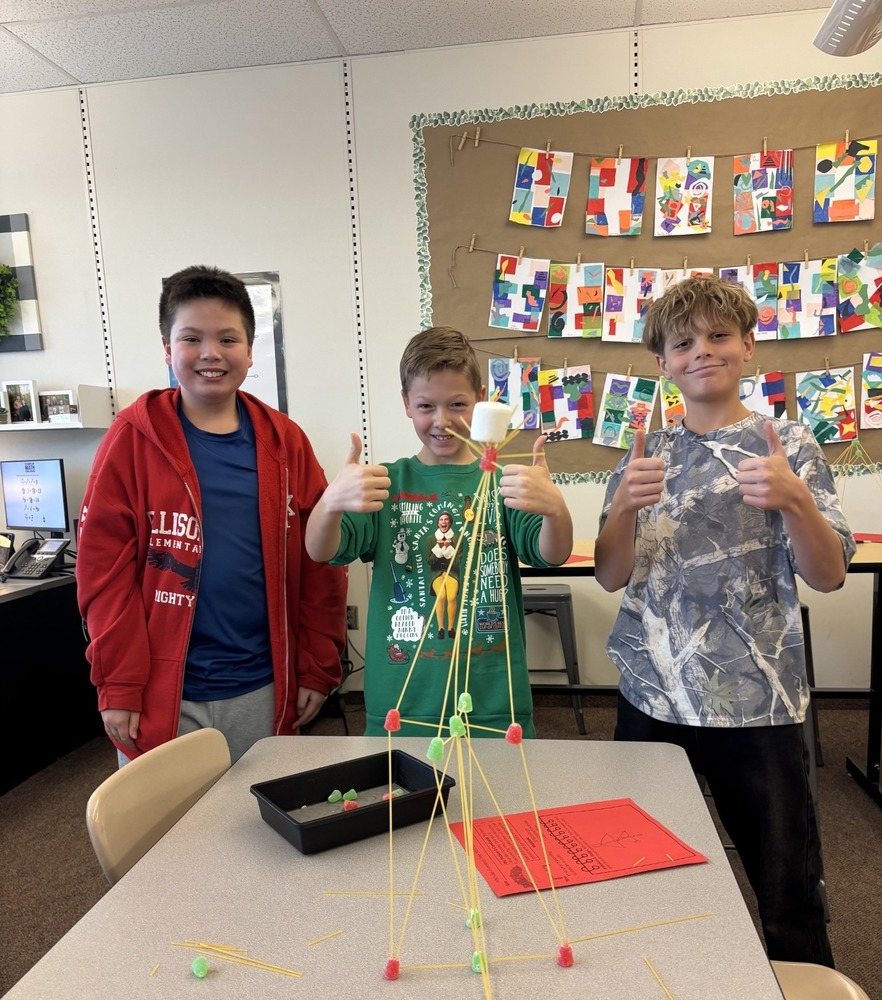 Students building in class with noodles and gumdrops