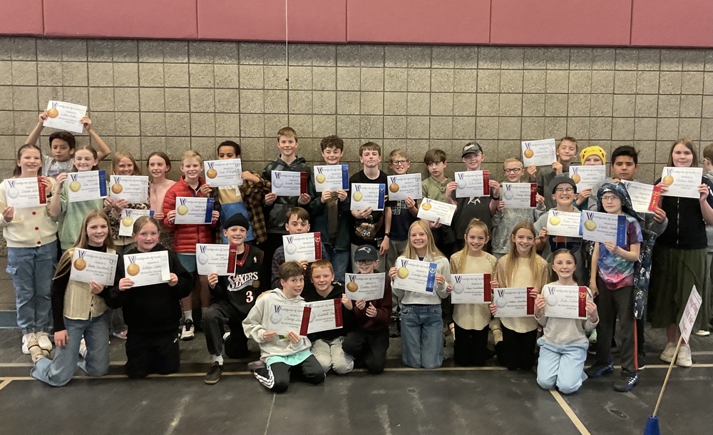 students holding an award