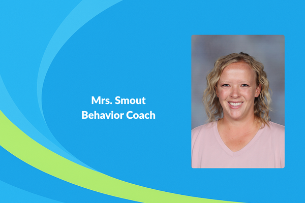 Mrs. Smout Behavior coach picture of women with blonde curly hair and pink shirt