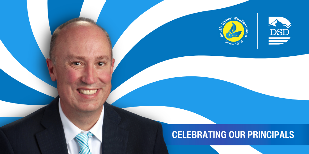 A principal in front of a wavy background with a banner that reads "Celebrating Our Principals"