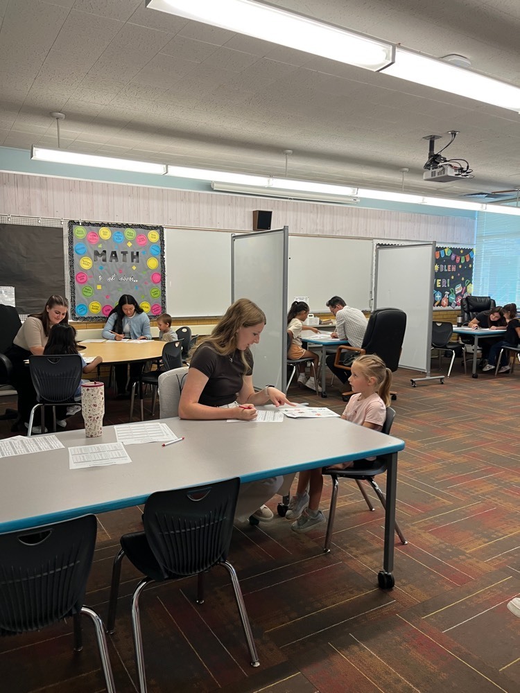 interns from the University of Utah doing language screening with students