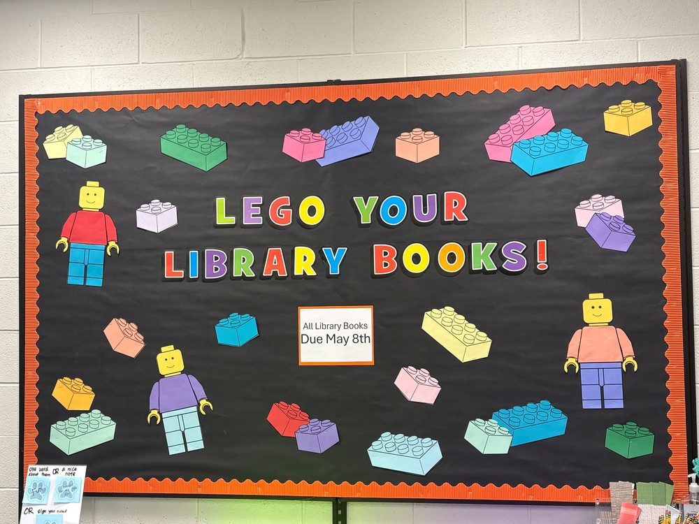 bulletin board that says Lego Your Library Books!  All library books due May 8th