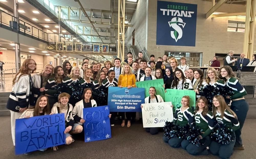 Mrs. Stumo and students celebrating