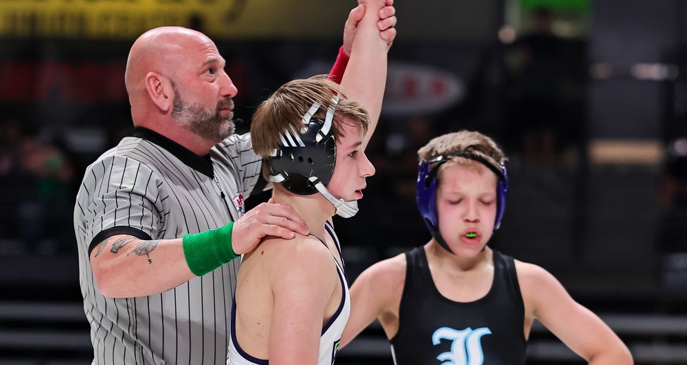 Reid Harris getting arm raised after winning wrestling state title
