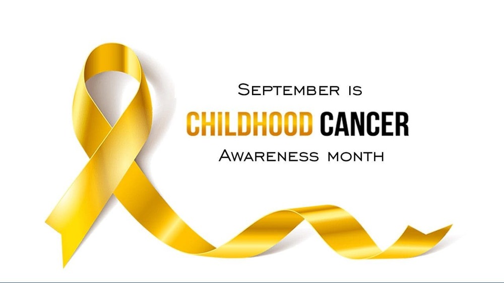 Gold ribbon with the words Sept. is childhoood cancer awareness month