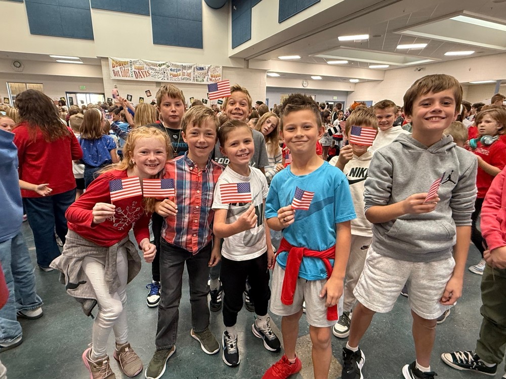 Students holding american flags