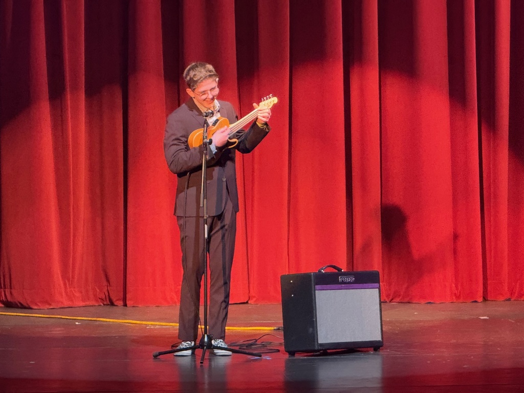 boy singing with ukulele