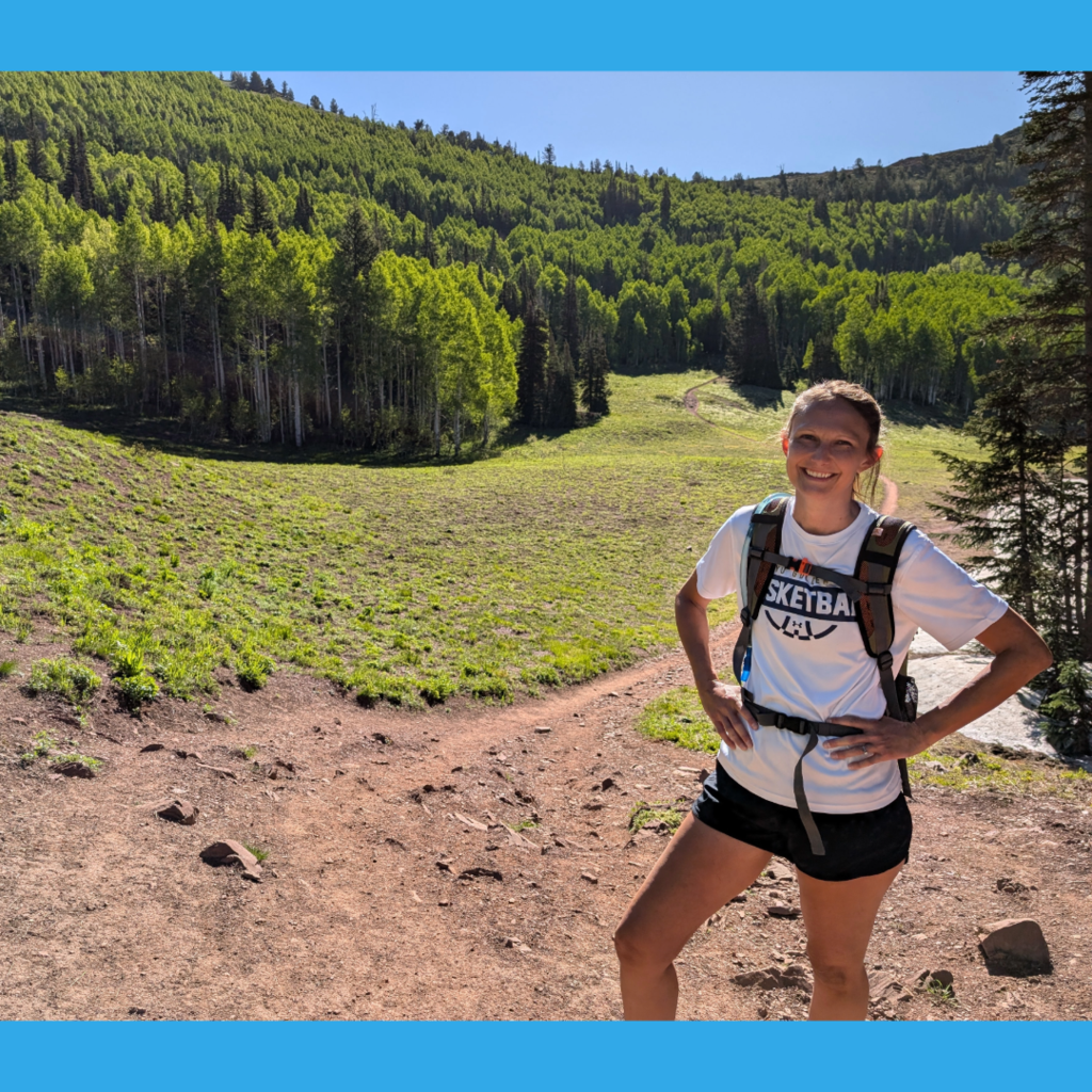 Photograph of Adrienne Dixon hiking in the mountains