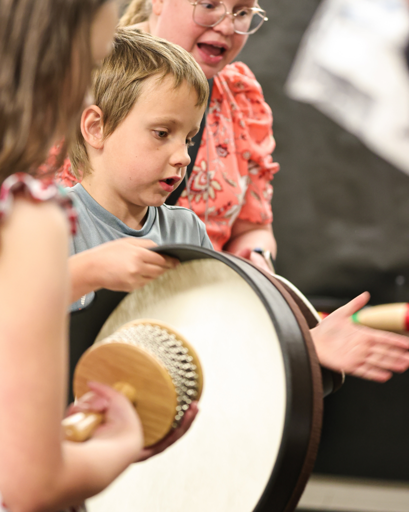 Students play instruments looking to the right.