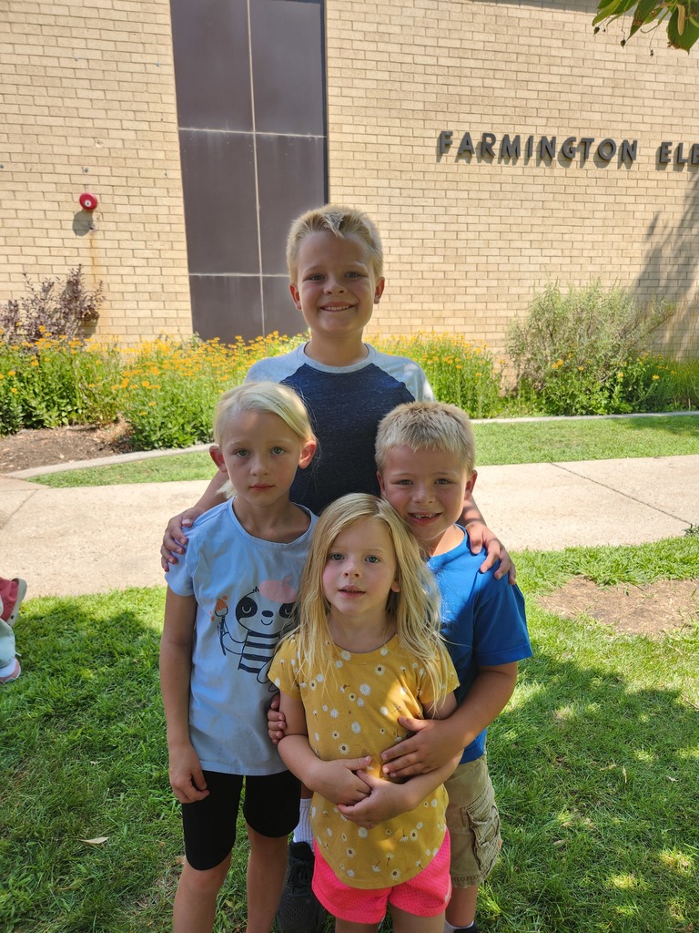 Kids standing in the shade at last year's Popsicles with the Principal event.
