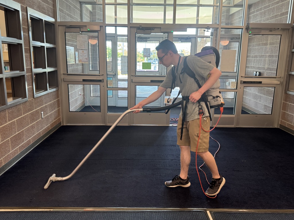 custodian vacuuming