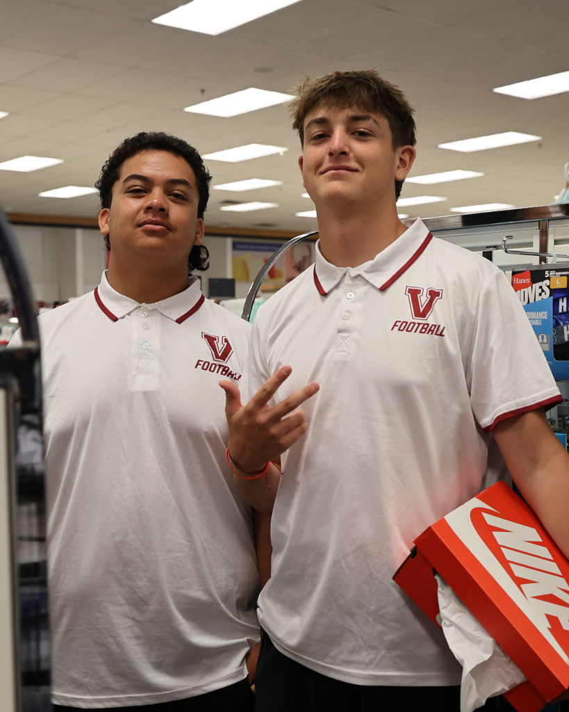 A photo of two Viewmont Football students helping shopping at Kohl's.