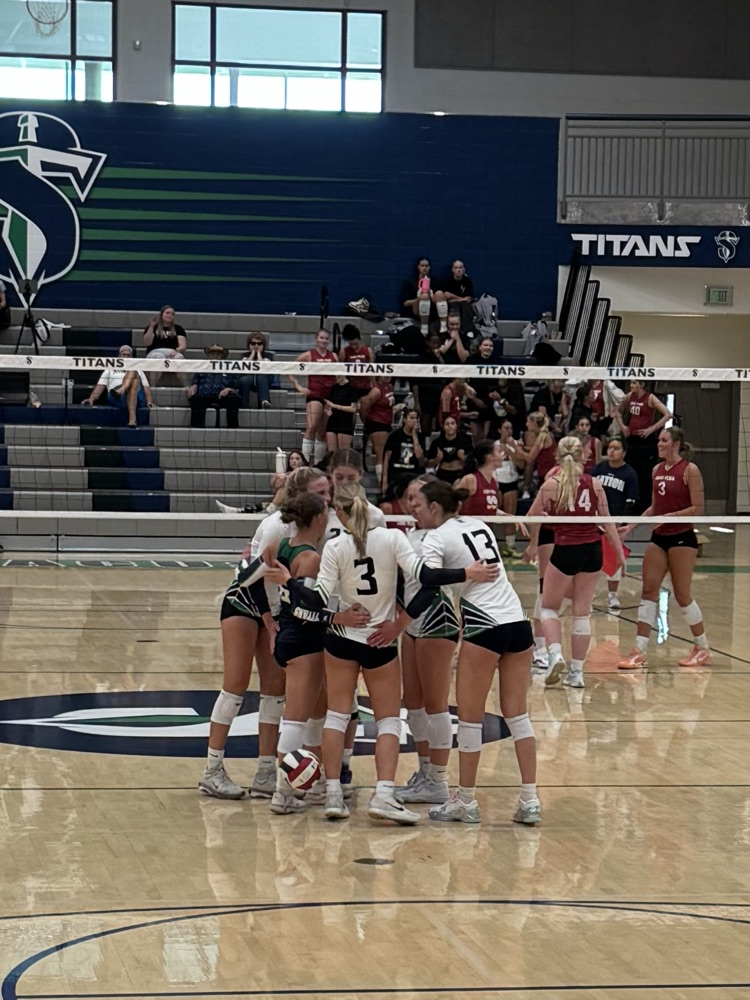 volleyball team in a huddle