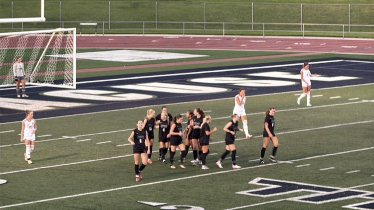 girls playing soccer