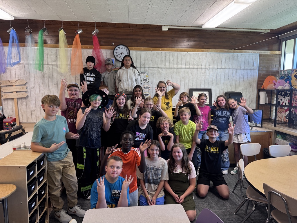 Mrs. Eskelson posing with her 6th graders ready to begin the new year