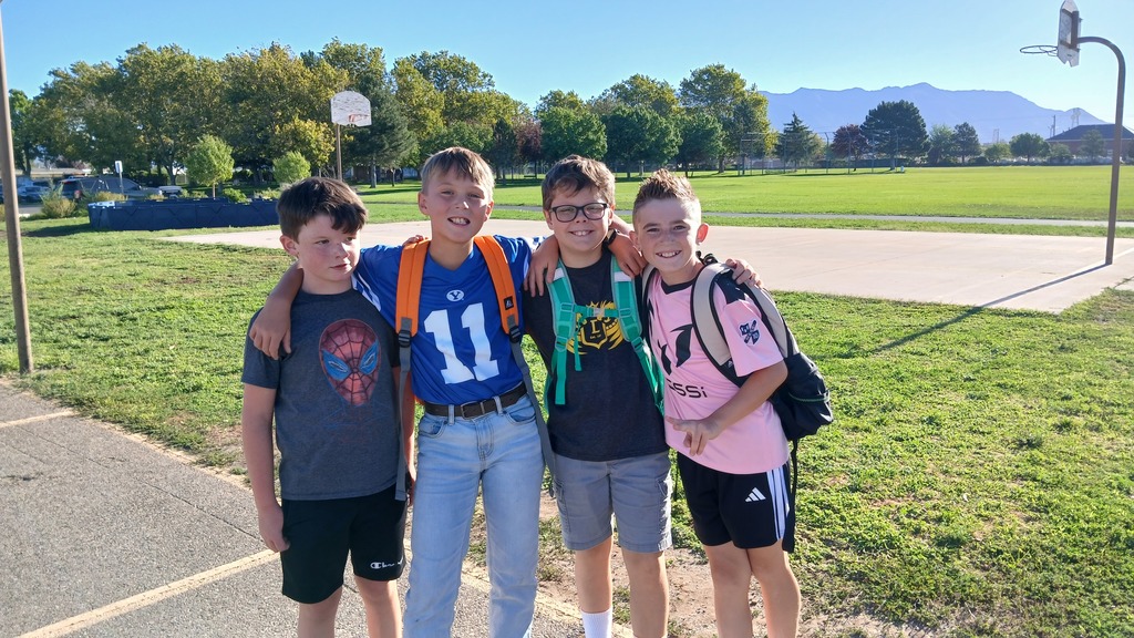 friends posing together as they all play on the playground