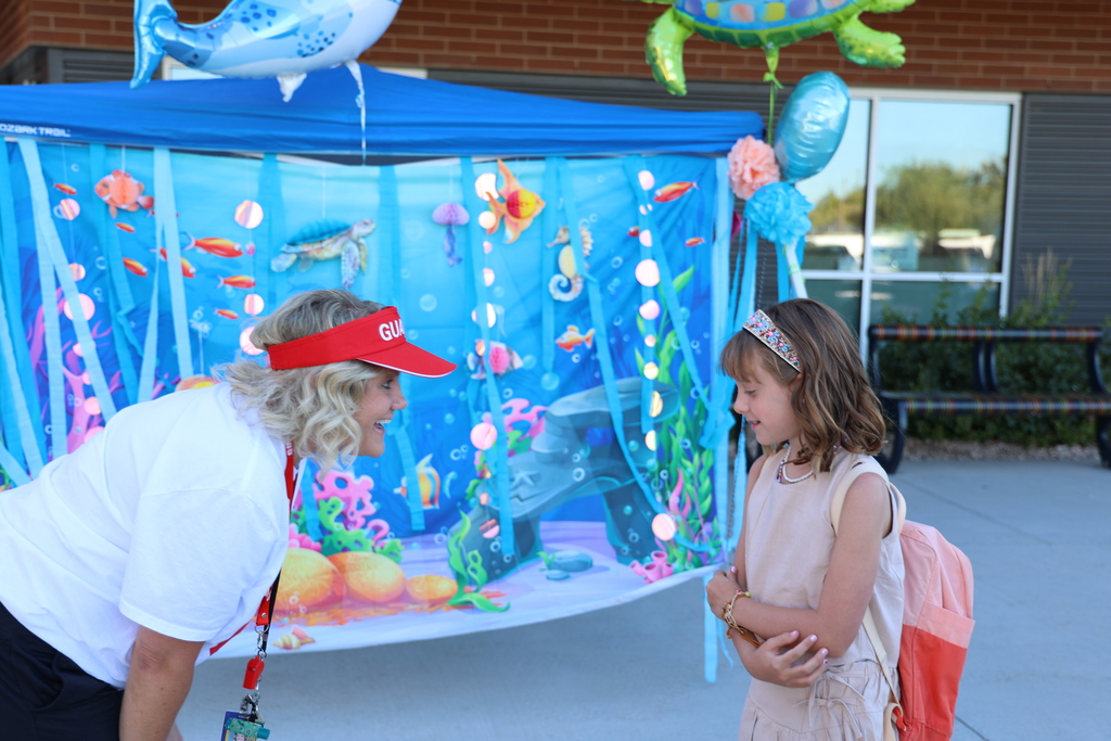 A principal talking with a student.