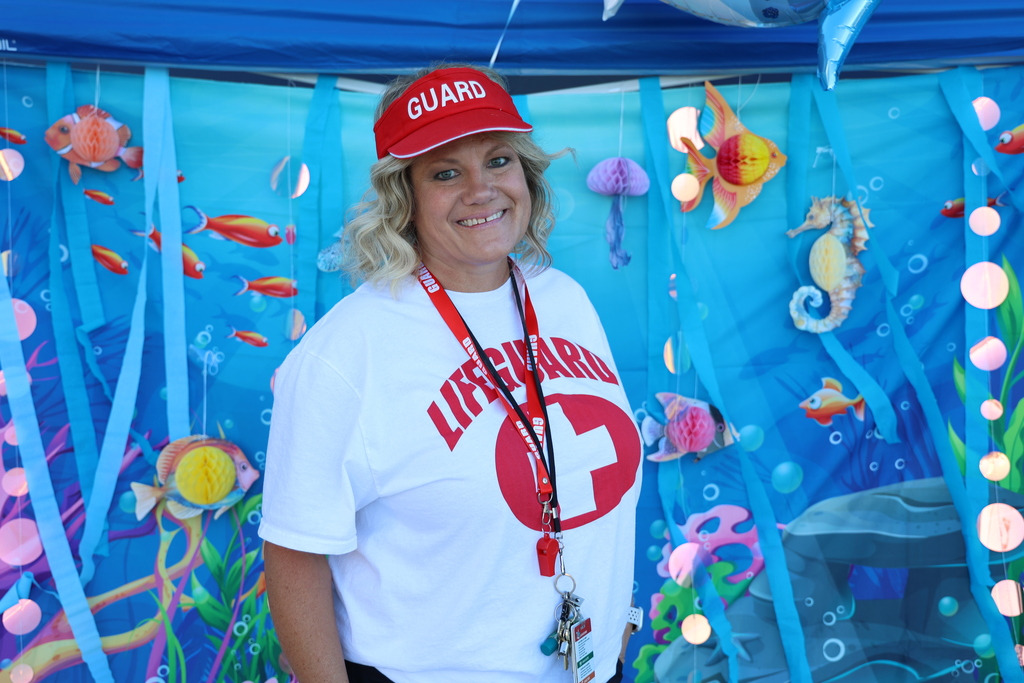 a principal smiling.