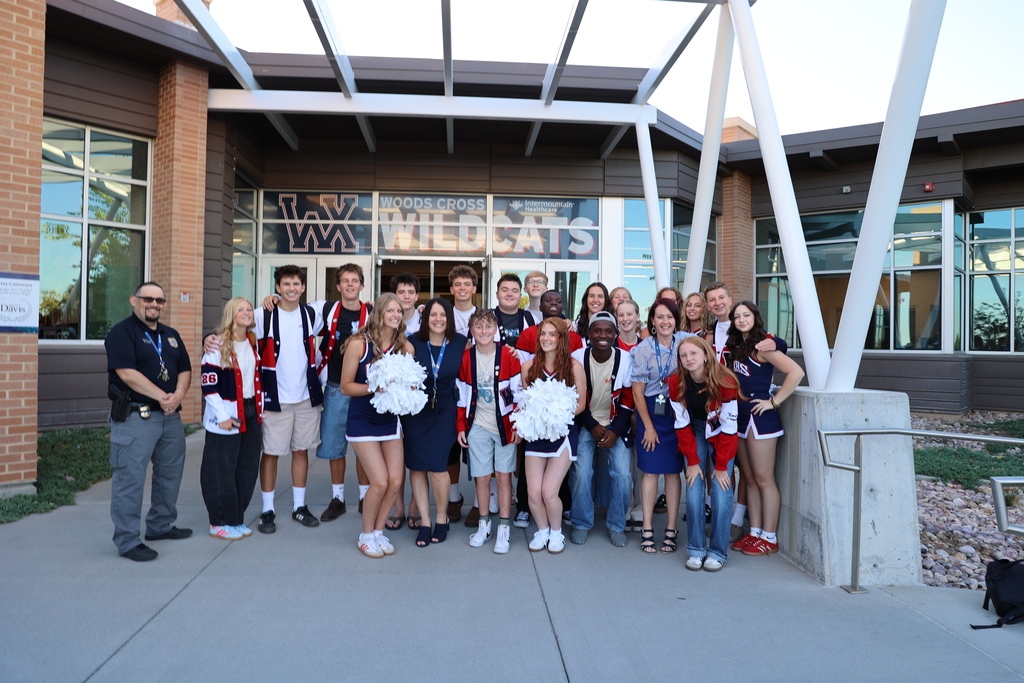a group of students pose with their new principal.