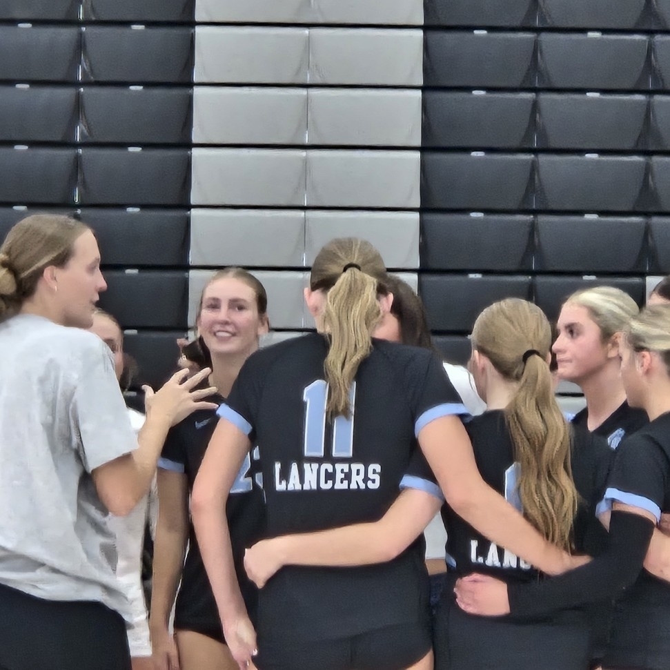 volleyball players in a huddle
