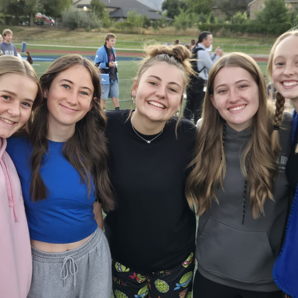 students standing and smiling for a picture