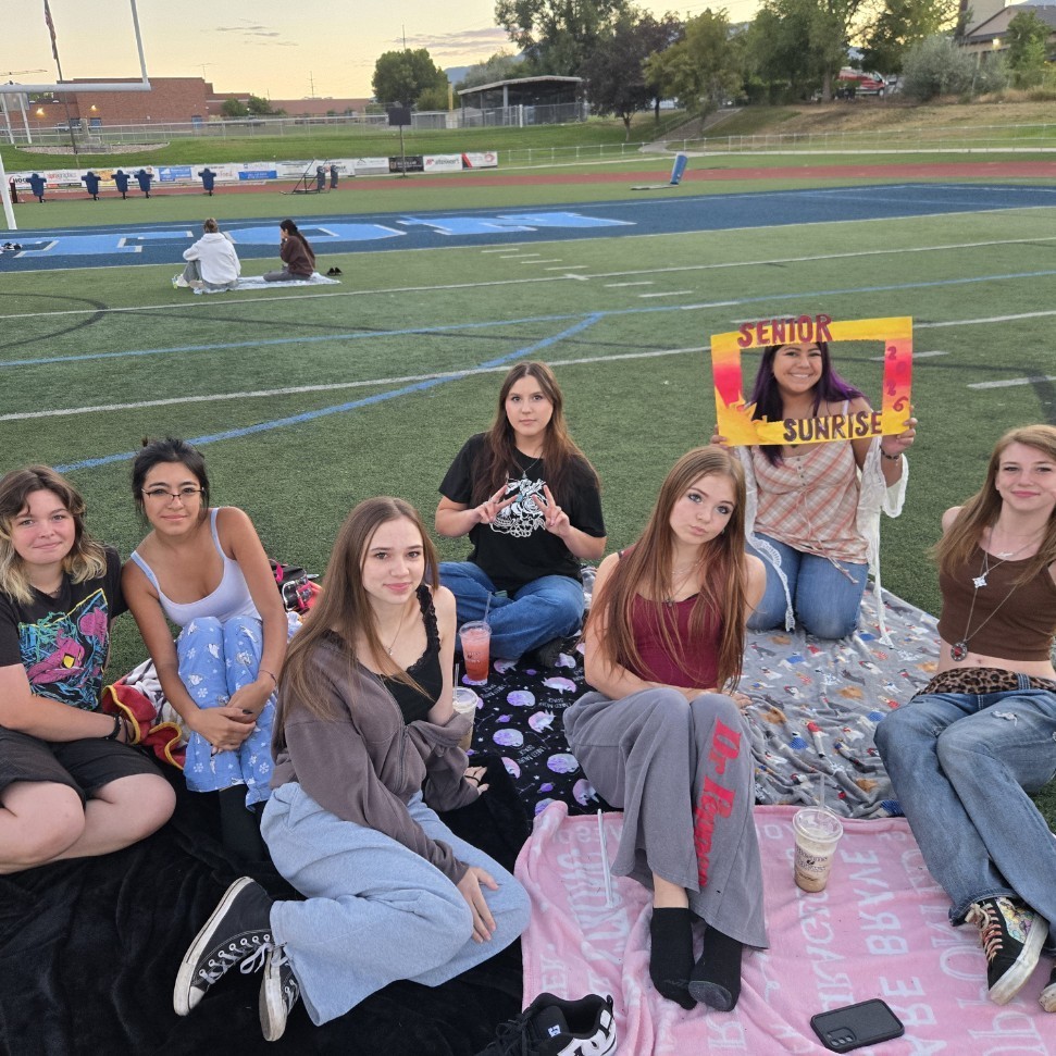 students sitting and smiling for a picture